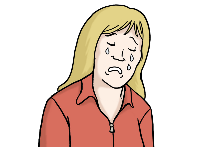Einer Frau mit langen blonden Haaren laufen die Tränen über das Gesicht. Ihre Mundwinkel sind nach unten gezogen.